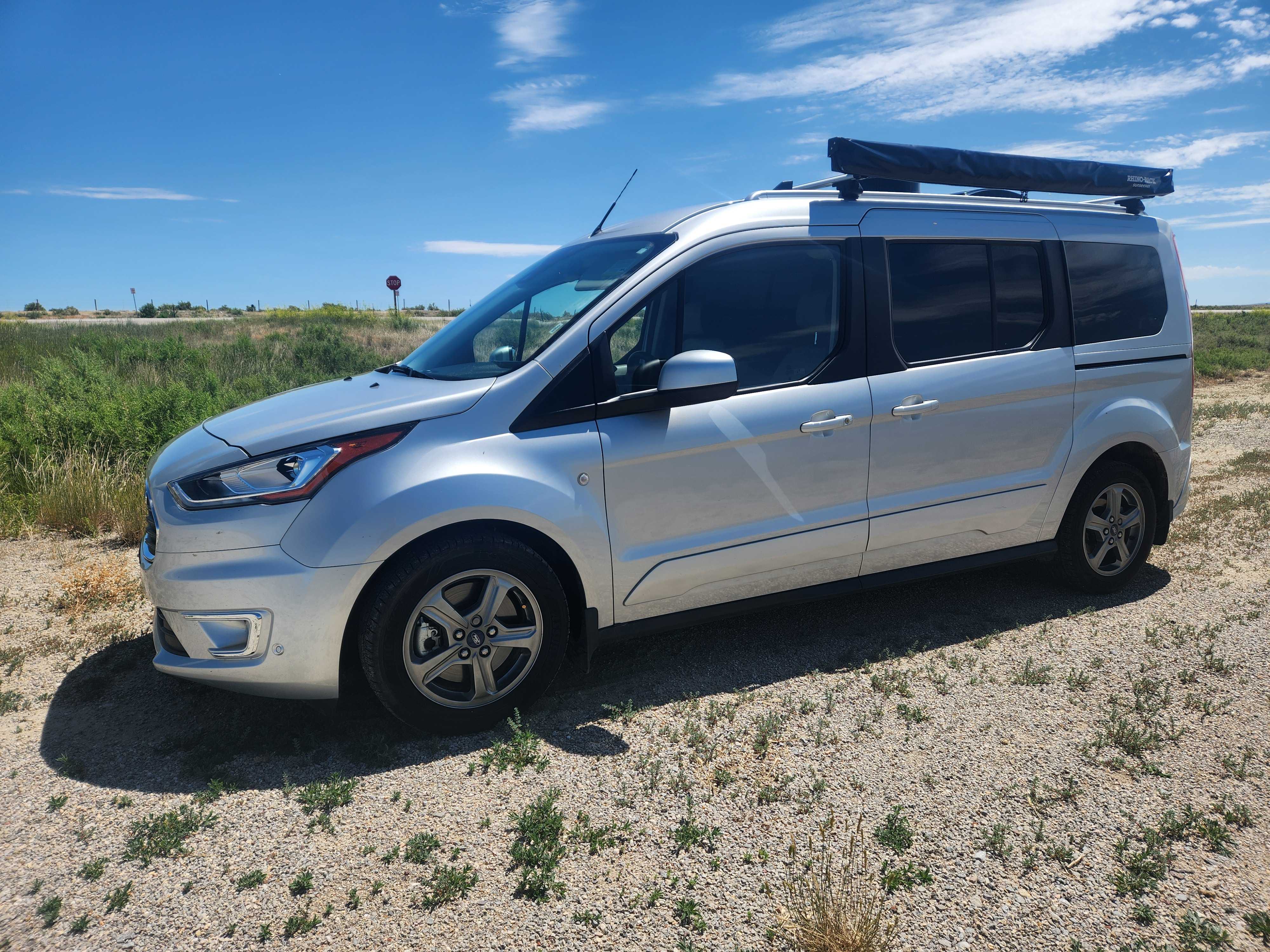 Mini-T Campervan at campground in scenic outdoor setting